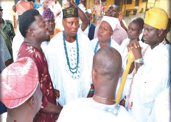 Curator, Badagry Slave Museum; Mr Anago James Akeem Oso, explaining a point of interest to the Ooni Oba Adeyeye Ogunwusi while Chief Wasiu Ajibola Abass, Bale of Yoyowe, Badagry, High Chief Agoloto of Badagry and others watch.