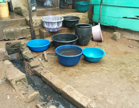 Beside the gutter are the bowls used in collecting water for drinking.