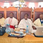 Bishop Okupevi distributes musical instruments at