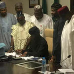 Acting President, Yemi Osinbajo signs 2017 budget