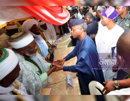 Vice President Yemi Osibajo, exchanging pleasantries with Imams and Alfas. With them is Governor State of Osun, Ogbeni Rauf Aregbesola, at 8 Day Fidau Prayers for Governor Aregbesola's mother, Alhaja Saratu Aregbesola