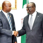 The new Permanent Secretary Federal Ministry of Labour and Employment, Mr Bolaji Adebiyi (right), receiving handing over notes from the erstwhile Acting Permanent Secretary, Mr Omoniyi Fagbemi.