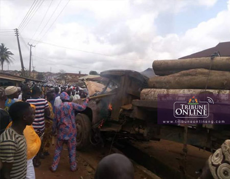 Angry mob destroying the ill-fated timber lorry that plow into a praying ground at Atikori in Ijebu-Igbo, on Friday. PHOTO: Olayinka Olukoya