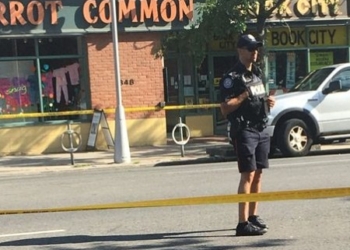 A police officer stands guard the morning after the attack