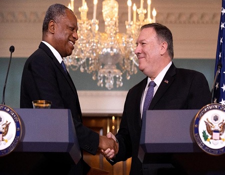 Nigeria's Minister of Foreign Affairs Geoffrey Onyeama, left, shakes hands with Secretary of State Mike Pompeo, Tuesday, Feb. 4, 2020, at the State Department in Washington