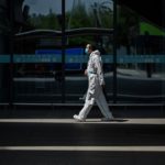Thousands leave Wuhan, travel ban