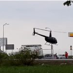 man lands his helicopter
