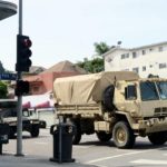 US cities extend curfews