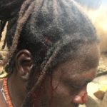 Thugs axe one protester