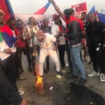 youths barricade East-West road
