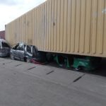 Container falls from trailer