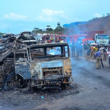 Two killed 13 vehicles burnt