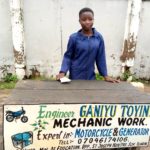 Teenage roadside female mechanic