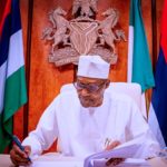 JUST IN: Buhari signs, fault Buhari for signing PIB into law