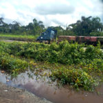 residents scoop spilled fuel