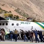 plane on runway after tyre burst