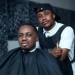 Man having a haircut. This is the first process on how to get waves