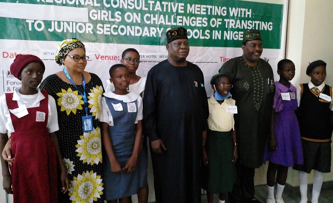 Education Specialist Officer, UNICEF Nigeria, Mrs Azuka Menkiti(2rd left); Deputy Executive Secretary (Services), UBEC, Dr Isiaka Kolawole(middle) and Executive Chairman of Lagos SUBEB, Mr Wahab Alawiye-King(2nd right) with some of the school girls from the South-west region at a consultative meeting in Lagos over low transition of girl-child from primary to junior secondary schools in Nigeria.
