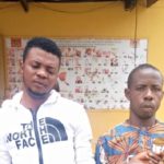Two arrested with human head