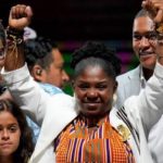 Black woman emerges,