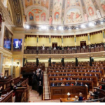 The Spanish parliament will vote on Tuesday whether to draw up legislation to abolish prostitution, cracking down further on pimping and introducing tougher penalties for men buying sex in a controversial initiative that has split the women's rights movement.,