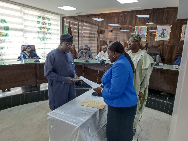 INEC Chairman swears in new REC