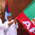 Buhari presents APC flag to Oyetola