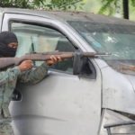 Gun battles rage,