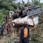 Truck falls on tricycle