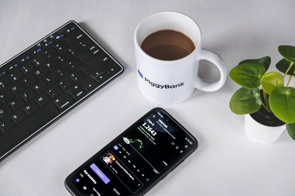 Cellphone with coffee and keyboard