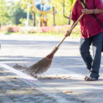 Court man sweeping