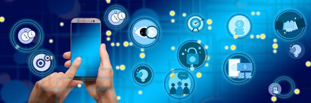 Hands holding a phone and connected to several icons