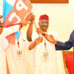 Tinubu presents APC flag to Edo gov candidate, running mate