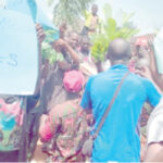 Residents protest over houses marked for