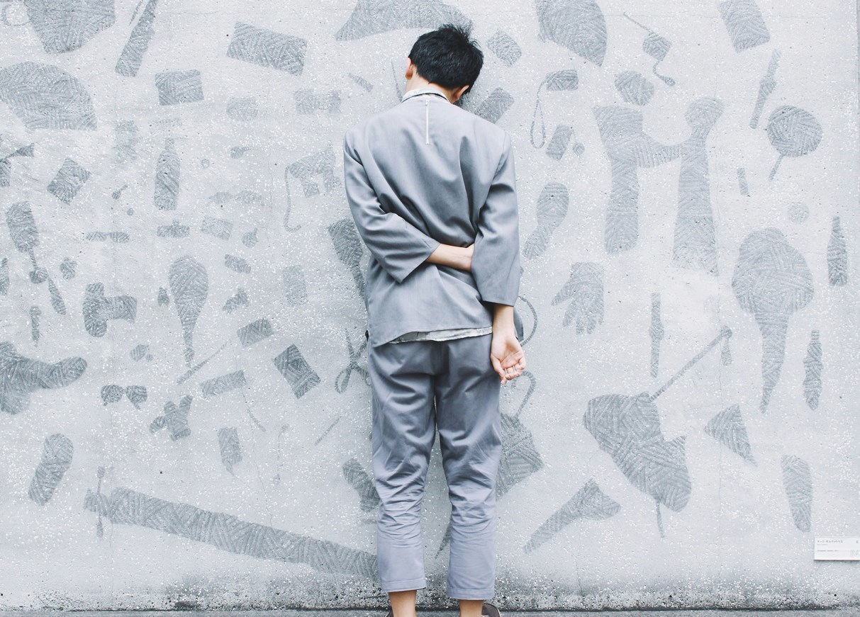 Unhappy person facing the wall