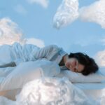 lady sleeping in a background of the cloud
