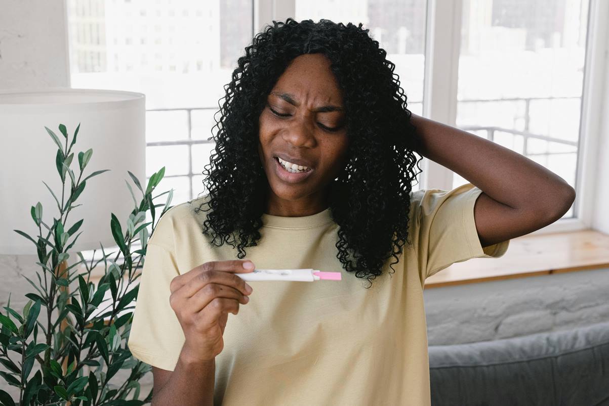 lady takes pregnancy test and is unhappy