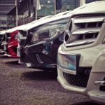 face new taxes, a fleet of cars at a car rental for people to rent