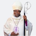 Bishop Okupevi distributes musical instruments at