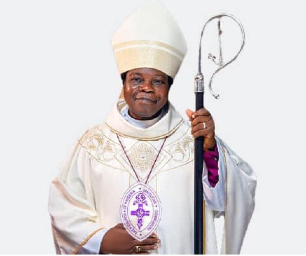 Bishop Okupevi distributes musical instruments at