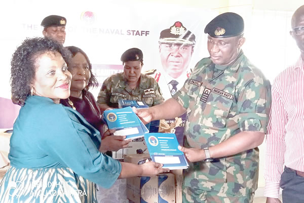 Navy donates pumping machine head tanks books others to schools in
