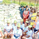 Corps members receive bags of rice cow cash gifts in