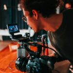 man holding video camera