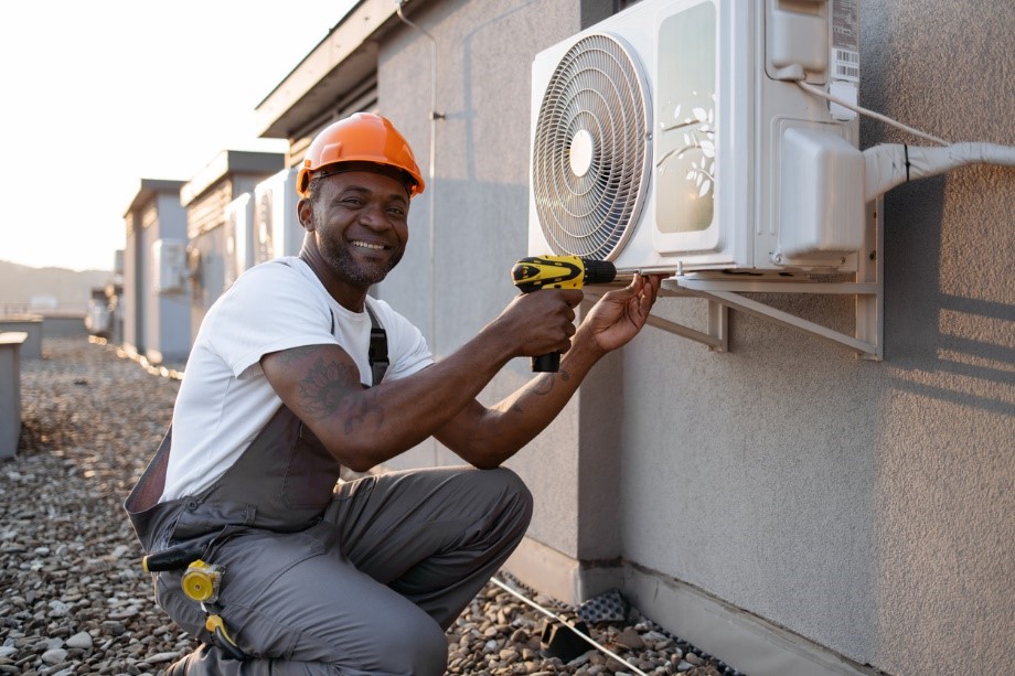 Technician Fixing air conditioner