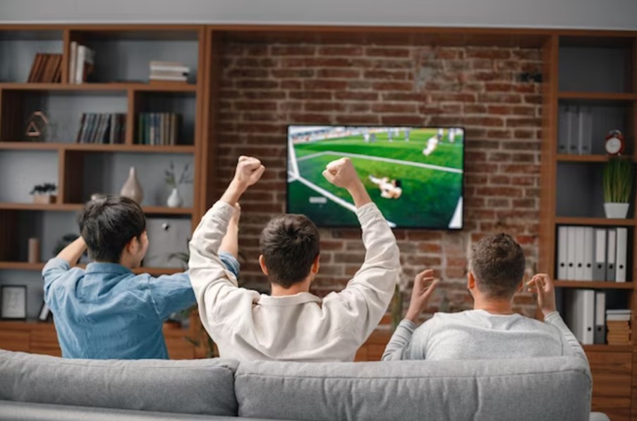 Friends watching football