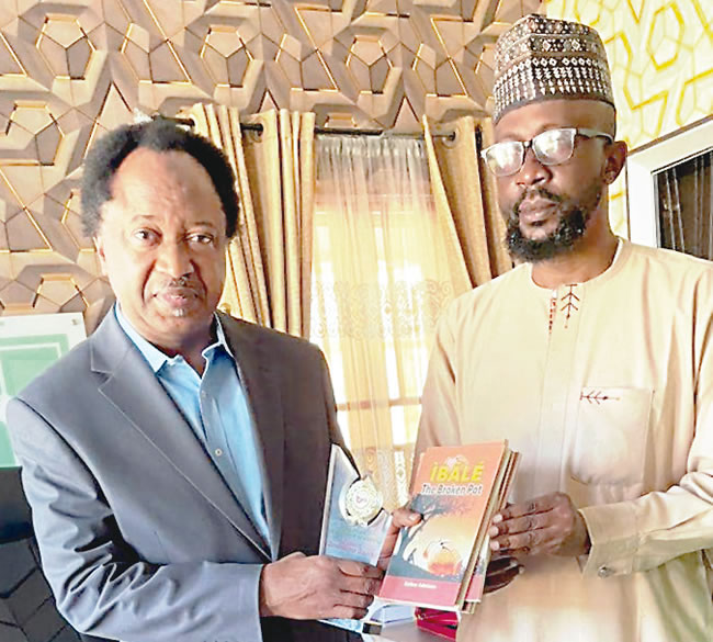 At book launch senator dons bag