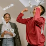 man and woman happy that they're about to become wealthy