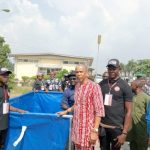 Senator Dafinone distributes