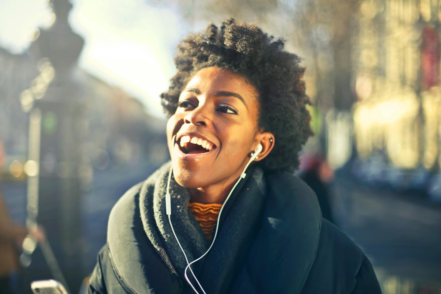 woman wearing noise-cancelling earphones