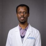 In the rapidly evolving field of biomolecular modelling and design—using computers to understand molecules like proteins and DNA and to create customised versions for specific purposes—having access to the right computational tools is essential. Dr Abeeb Abiodun Yekeen, a computational structural biologist and postdoctoral researcher at the University of Texas Medical Center (Dallas, USA), has addressed this need with BioMoDes—a comprehensive online repository of tools for biomolecular modelling and design. Since its launch, BioMoDes has gained popularity online, particularly within the structural bioinformatics community, quickly becoming a go-to resource for researchers worldwide. With the 2024 Nobel Prize in Chemistry recognising achievements in computational protein design and structure prediction, the significance of resources like BioMoDes has never been more apparent. In this interview, Dr Yekeen shares insights into the inspiration, impact, and future plans for BioMoDes. Introduction and Inspiration What is BioMoDes? BioMoDes, short for Biomolecular Modelling and Design, is a web-based platform (https://abeebyekeen.com/series/biomodes) that curates the most advanced computational tools for studying biomolecules. It enables researchers, students, and professionals to discover suitable cutting-edge technologies for various bioinformatics tasks. By centralising these resources, BioMoDes simplifies access to the right tools for specific needs. What inspired you to create BioMoDes? The field of biomolecular modelling and design has been advancing rapidly, with new tools emerging almost daily. Researchers often struggle to keep track of or find the appropriate ones for their specific needs. I created BioMoDes to bridge this gap, providing a single platform where users can easily locate the resources they require. How does your background influence this initiative? My doctoral research involved the application of algorithms for protein design and structure modelling, and I actively use many of these tools in my current research. These experiences gave me firsthand insight into the challenges researchers face in accessing and utilising suitable computational tools, inspiring me to make these tools more accessible. Features and Scope What types of tools can users find in BioMoDes? The repository includes tools for structure prediction, molecular design, property prediction, databases, ligand design, and more. How is BioMoDes organised? Tools are categorised by their primary functions, with each tool accompanied by a brief description, links to associated publications, documentation, code, and webservers. What sets BioMoDes apart from similar platforms? BioMoDes prioritises quality and impact. Each tool is evaluated before being added to ensure significant potential and relevance. Who would benefit most from BioMoDes? Researchers, educators, students, and industry professionals working in biomolecular modelling and design will find it invaluable. It also serves as a great starting point for newcomers to the field. What impact do you hope to achieve with BioMoDes? I aim for BioMoDes to become the go-to platform for identifying the most important tools in the field and determining their suitability for specific tasks. Its growing popularity reinforces its value as a resource addressing these needs. Challenges and Future Plans What challenges did you face while building BioMoDes? The main challenges included ensuring the quality of the tools, keeping track of new literature, and maintaining updates for BioMoDes. How do you plan to keep BioMoDes up to date? I actively monitor developments in the field for new tools and updates, while encouraging developers and followers of BioMoDes to suggest additions. How does BioMoDes reflect trends in biomolecular modelling? The 2024 Nobel Prize in Chemistry underscores the growing significance of computational approaches. BioMoDes aligns with this trend by curating tools that empower researchers to harness bioinformatics in transformative ways. This move towards democratising resources is accelerating progress across fields like drug discovery, synthetic biology, and biotechnology. What message do you have for young researchers entering this field? Structural bioinformatics tools are incredibly empowering, but their effectiveness depends on the questions you ask. Stay curious, collaborate, and explore widely. This is an exciting time to be involved in biomolecular modelling and design. By creating BioMoDes, Dr Yekeen has provided a valuable resource for the bioinformatics community. Its growing influence highlights the critical role of computational tools in shaping the future of science and innovation.
